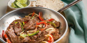 These Steak Fajitas from Autumn Calabrese’s FIXATE cookbook features extra lean beef sirloin, a savory blend of spices, and tangy fresh squeezed lemon.