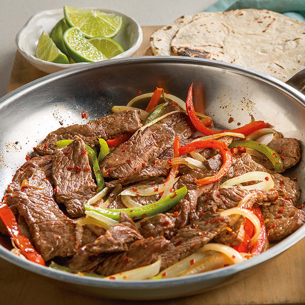 These Steak Fajitas from Autumn Calabrese’s FIXATE cookbook features extra lean beef sirloin, a savory blend of spices, and tangy fresh squeezed lemon.