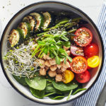 This Vegan Buddha Bowl is no sad desk lunch, this hearty bowl features whole grains, fresh and roasted veggies, hemp seeds and delicate sprouts.