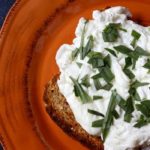 Make these Herb Poached Eggs for a savory breakfast featuring fluffy poached egg whites, freshly chopped tarragon, and a single slice of whole grain toast.
