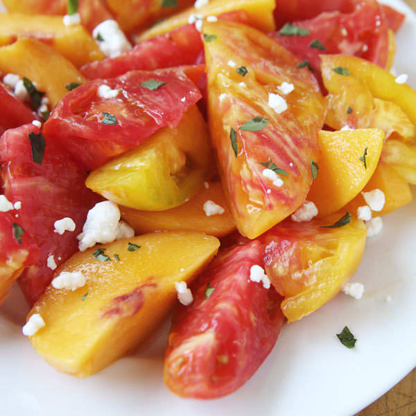 sliced peach and heirloom tomato salad