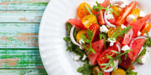 watermelon and heirloom tomato salad with arugula and feta