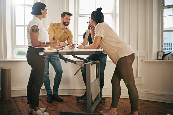 People working at standing desk