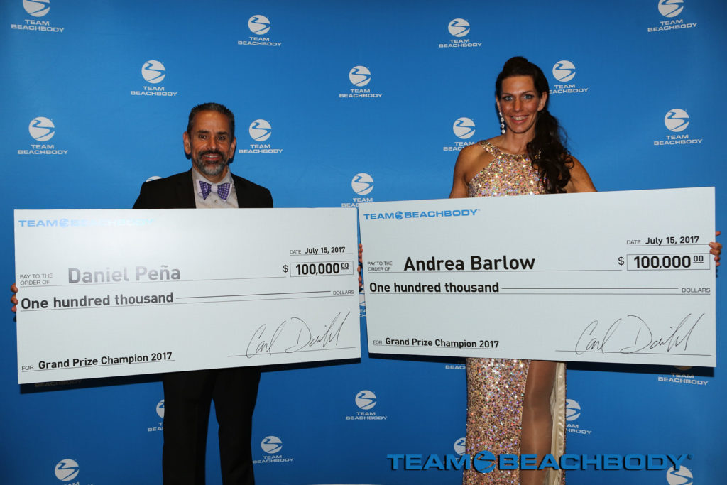 Beachbody Challenge Grand Prize winners Daniel Pena and Andrea Barlow with their $100,000 checks