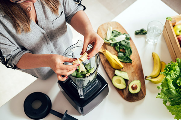 Woman making healthy smoothie