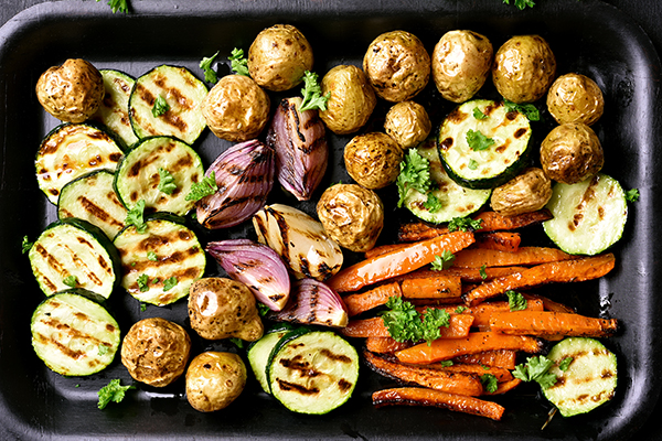 Roasted vegetables on baking sheet