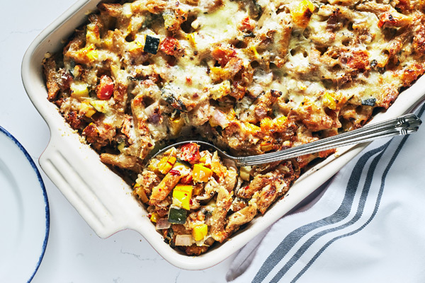 This baked ziti casserole recipe is filled with summer vegetables like tomatoes and zucchini, plus mozzarella, parmesan, and ricotta cheese. Perfect for meal prep, weeknight meals, and potlucks.