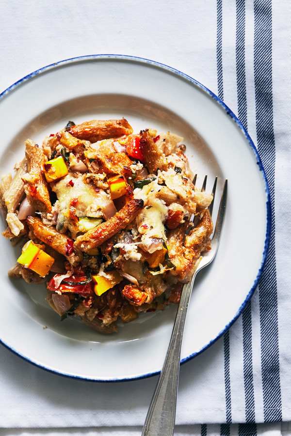 This baked ziti casserole recipe is filled with summer vegetables like tomatoes and zucchini, plus mozzarella, parmesan, and ricotta cheese. Perfect for meal prep, weeknight meals, and potlucks.