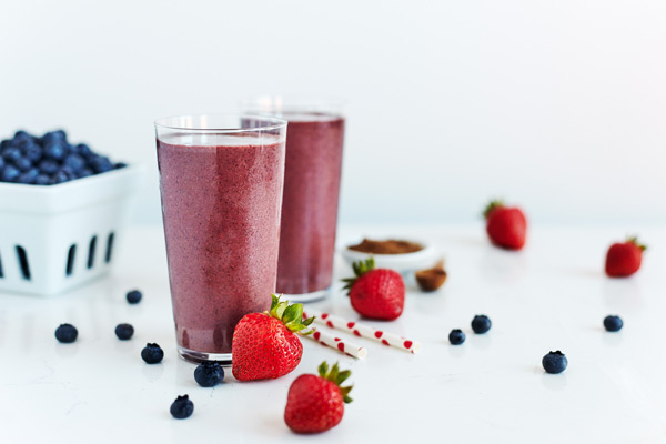 Chocolate-dipped strawberries are the decadent inspiration for this Strawberry Thunder Shakeology smoothie recipe made with strawberries, blueberries, and chocolate. 
