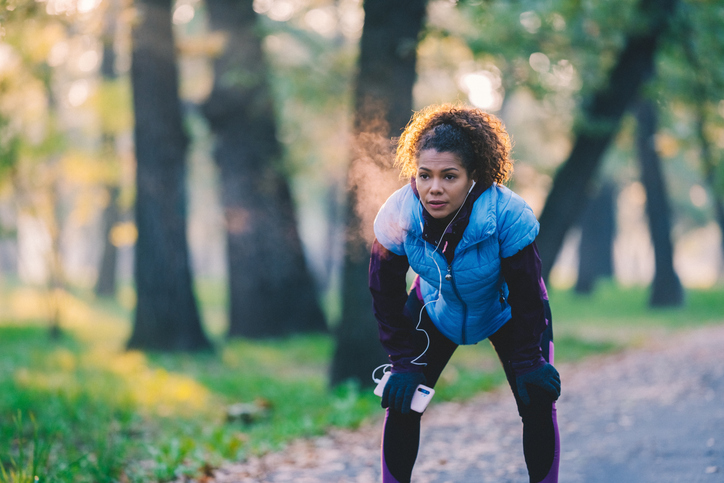 woman taking rest during run | Aerobic vs Anaerobic Exercise