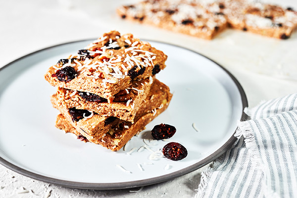 These Cranberry Bliss Bars taste just like the original only these are healthier, with smooth almond butter, shredded coconut, and pumpkin pie spice.