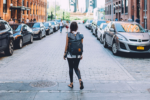 Woman walking down a street