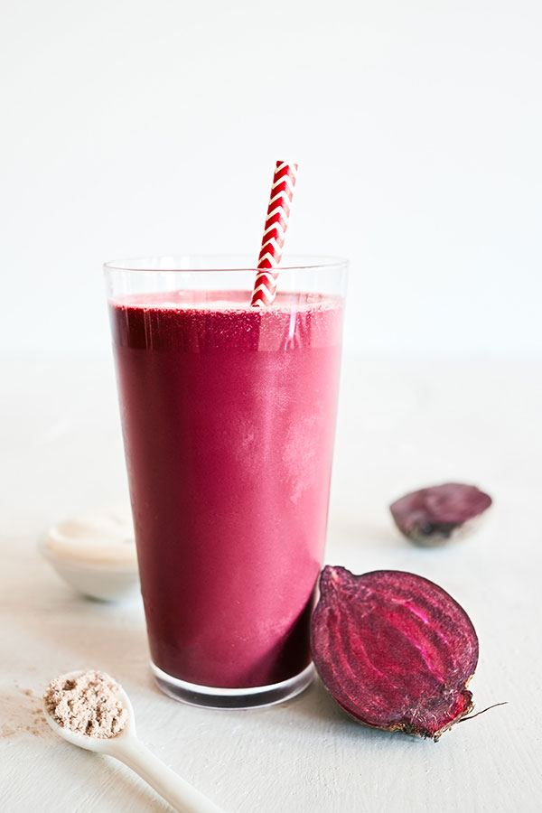 This decadent Red Velvet Smoothie features creamy Chocolate Shakeology, tangy balsamic vinegar, and fresh beet juice for that classic crimson hue.