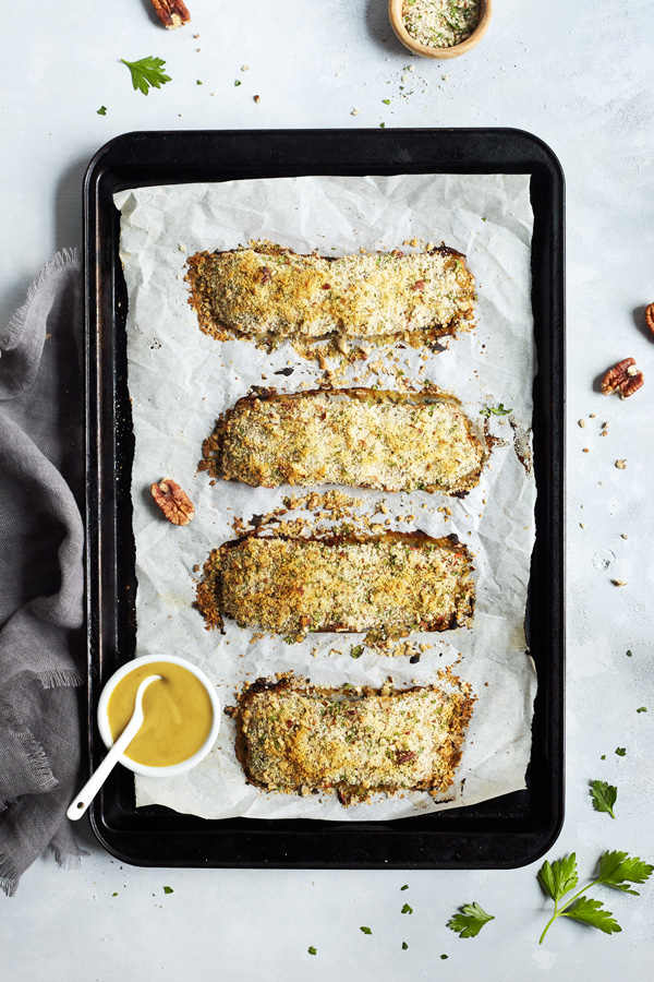 For an easy weeknight meal that's bursting with flavor try this Baked Salmon with Dijon featuring whole wheat bread crumbs, Dijon mustard, and raw honey.