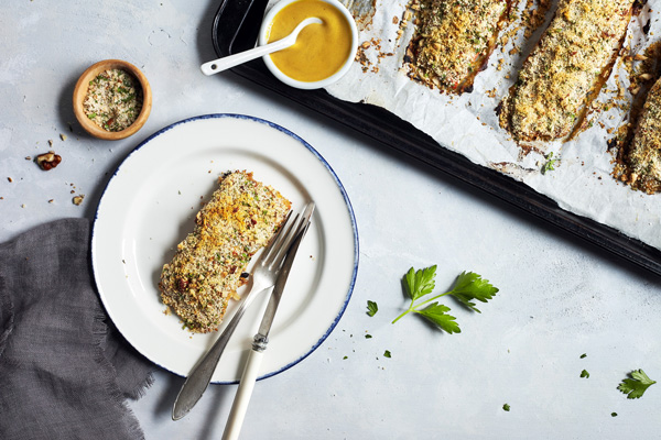 For an easy weeknight meal that's bursting with flavor try this Baked Salmon with Dijon featuring whole wheat bread crumbs, Dijon mustard, and raw honey.