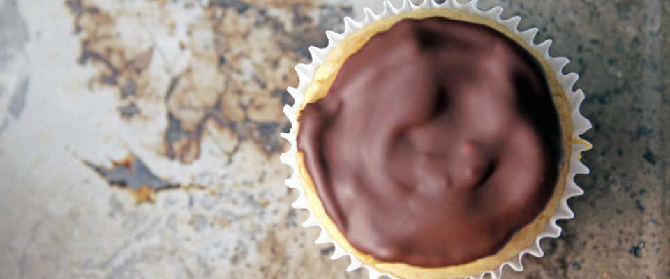 These healthier double Peanut Butter Cupcakes are ideal for your next party, featuring gooey bitter sweet chocolate chunks and all natural peanut butter.