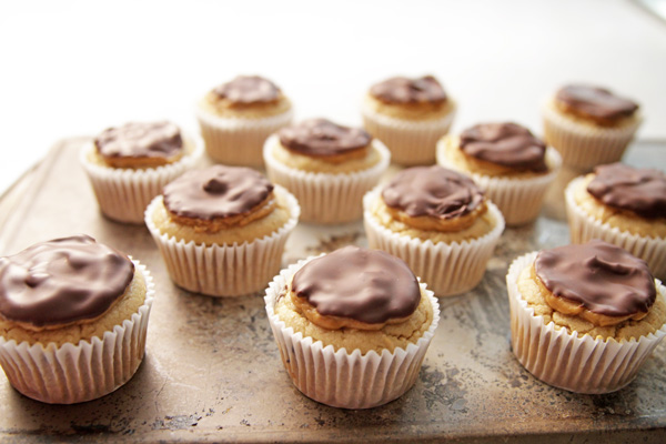 These healthier double Peanut Butter Cupcakes are ideal for your next party, featuring gooey bitter sweet chocolate chunks and all natural peanut butter.