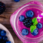 This Tripple Berry Breakfast Smoothie is one of our most popular healthy breakfast smoothies featuring creamy almond milk and tangy dark berries.