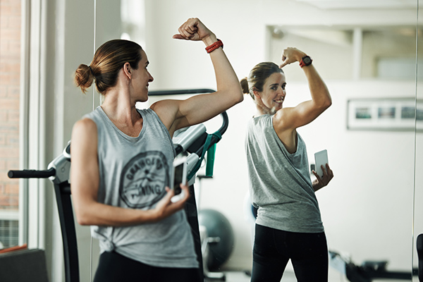 Woman taking selfie at the gym