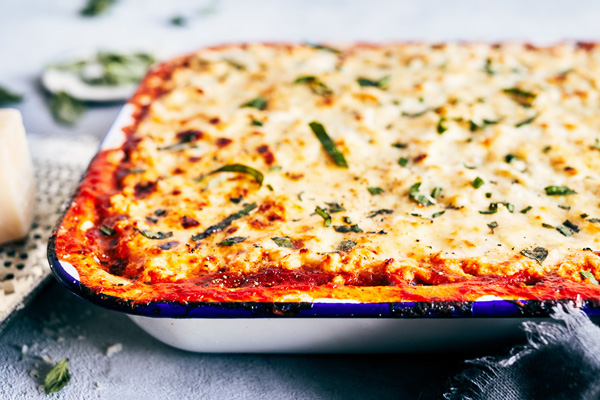 This sinfully delicious Spaghetti Squash Lasagna is made with all-natural marinara, part-skim ricotta cheese, and healthy spaghetti squash.