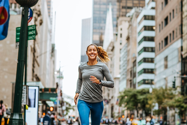 woman running in city | Cardiorespiratory Endurance