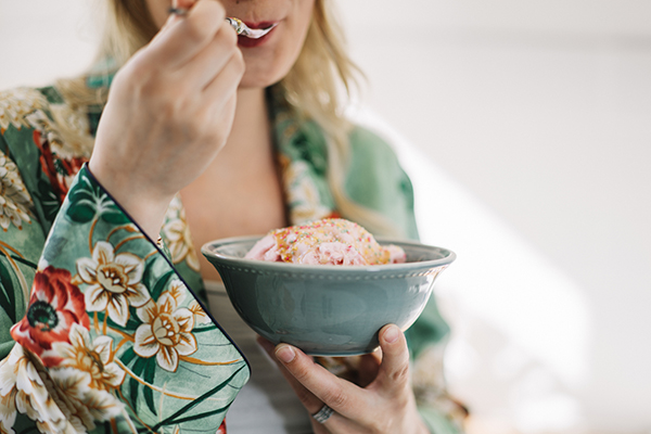 Woman eating a bowl of ice cream