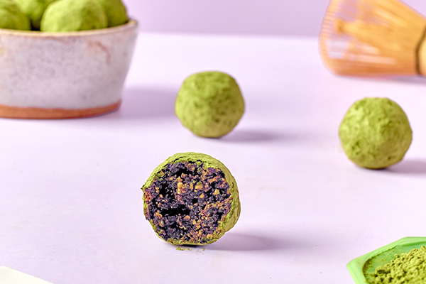 Chocolate Matcha Vegan Energy Ball with bite taken