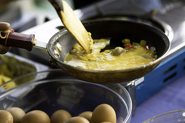 Person making omelet