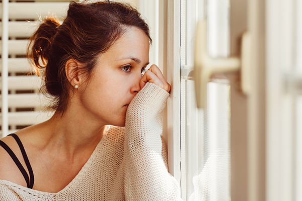 Woman staring out window