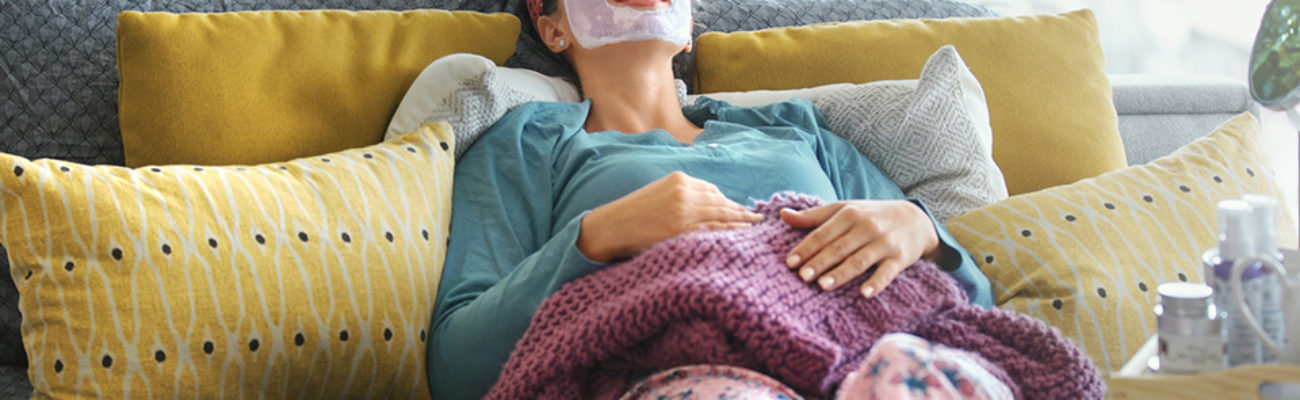 Woman relaxing with a face mask