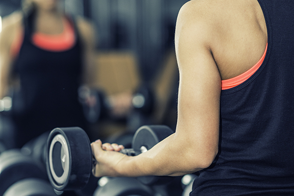 Woman lifting dumbbell