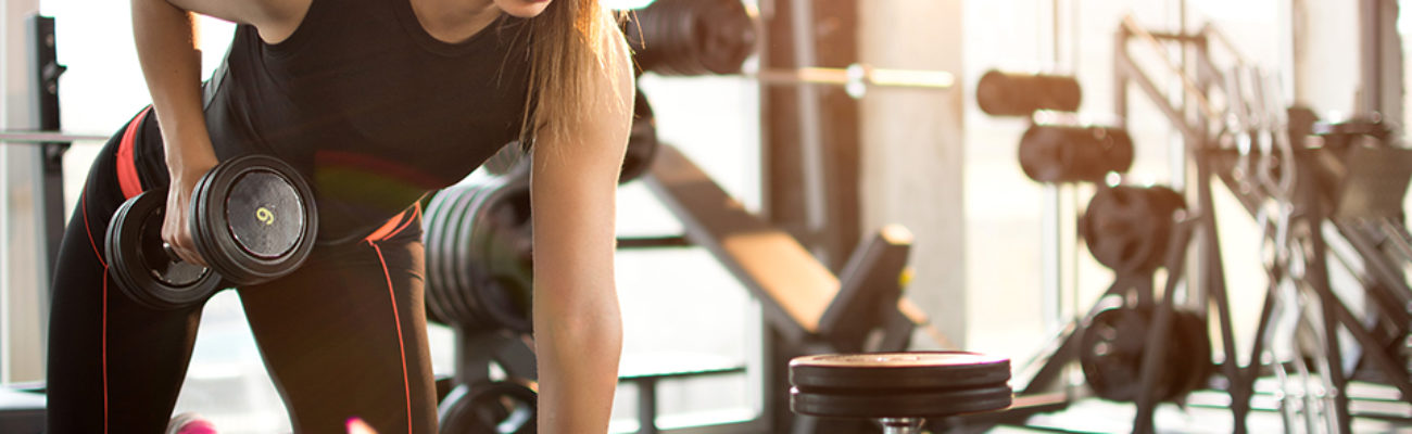 Woman lifting dumbbell