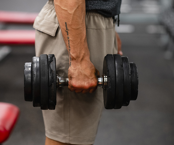 Man holding dumbbell