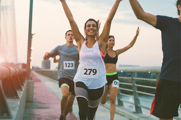 group of marathon runners celebrating | Running Motivation