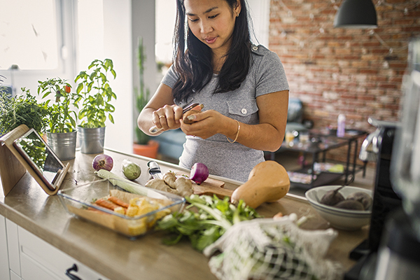 Woman at home making healthy meal