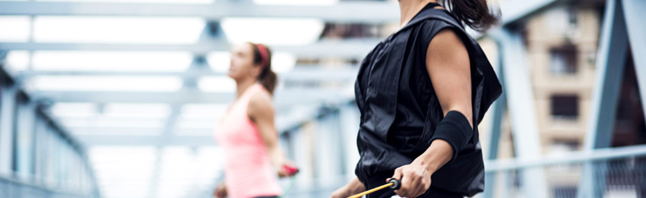 Women jumping rope outdoors