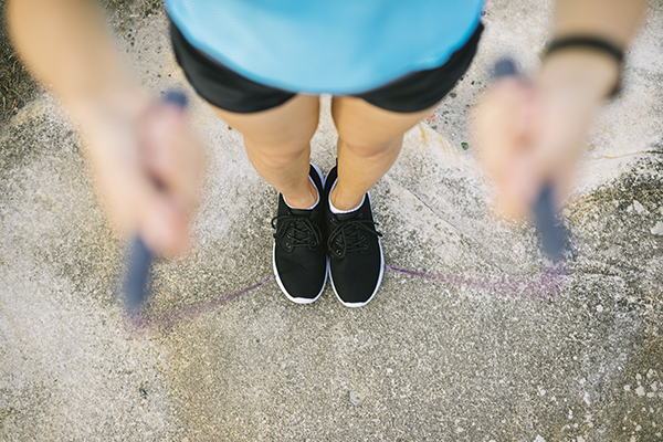 Woman holding jump rope in hands