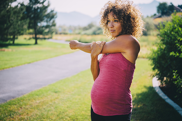 Pregnant woman walking outside