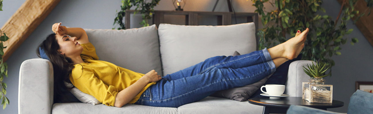 Woman relaxing alone on the couch
