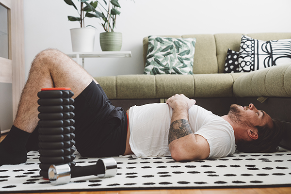 Tired man laying on floor