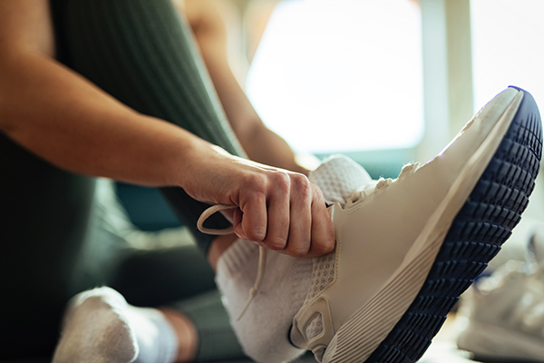 Woman trying on running shoes