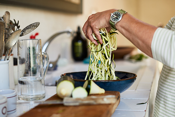 Woman making zucchini noodles