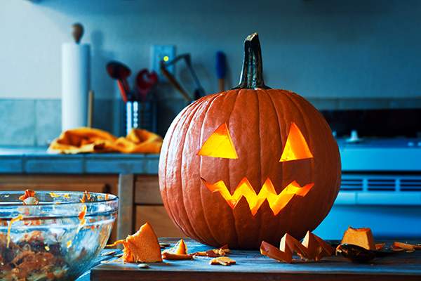 Jack-o-lantern sitting in kitchen