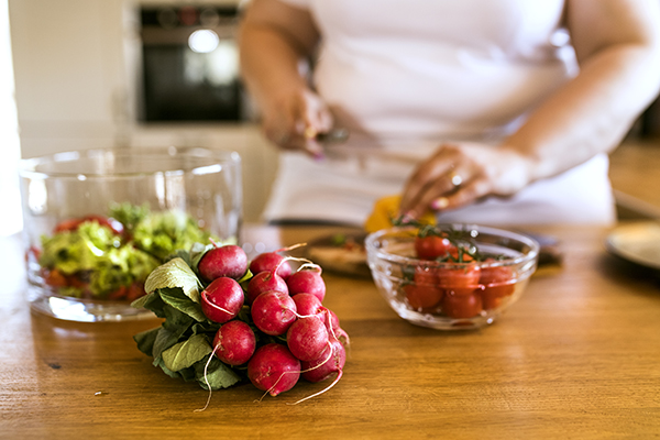 Woman chopping vegetables