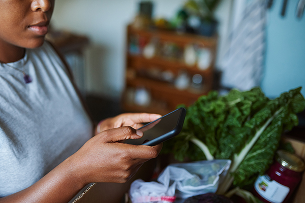 Woman making grocery list