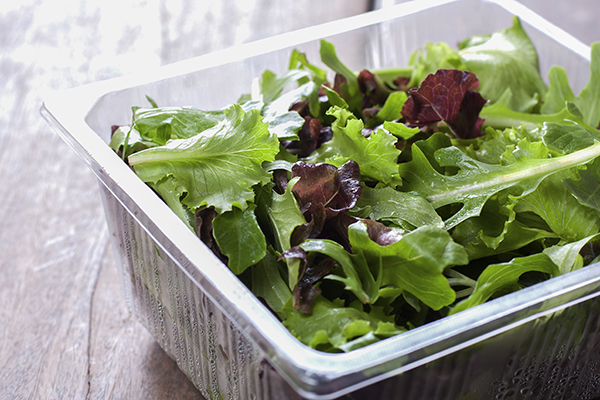 Greens in a plastic container