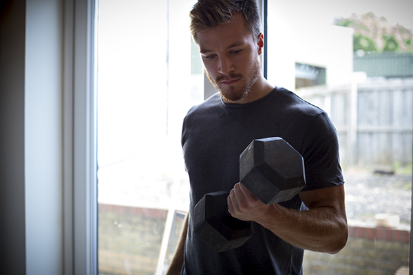 Man doing strength training at home