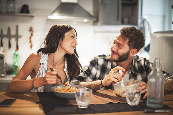 Couple eating and laughing together