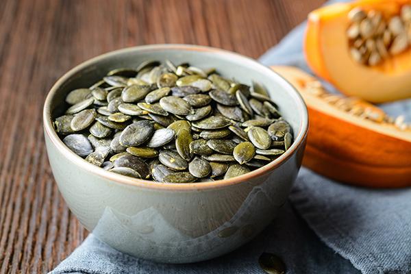 Pumpkin seeds in ceramic bowl