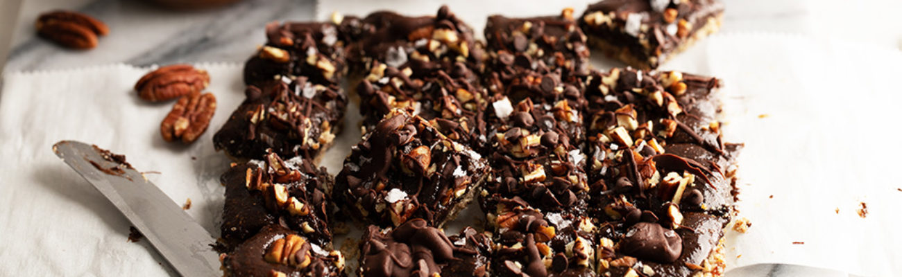 Salted Chocolate Maple Pecan Bars on counter